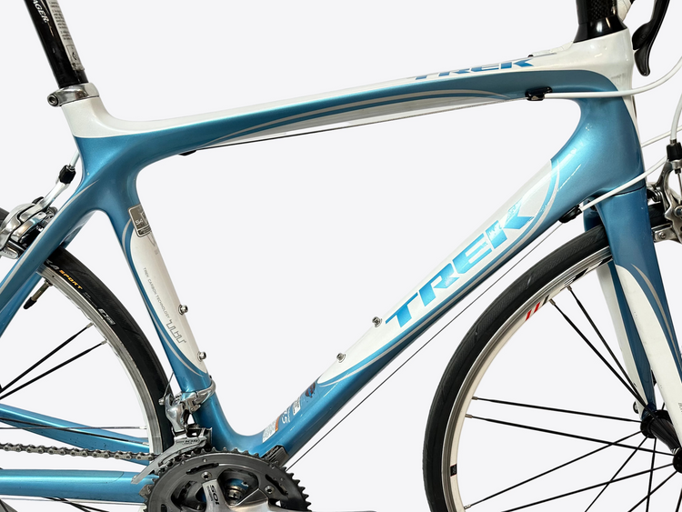 Blue and white Trek bicycle on a white background