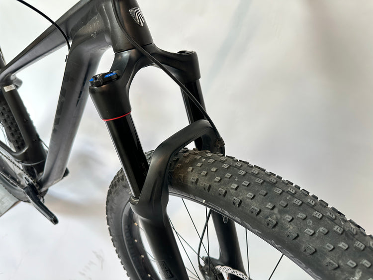 Close-up of a bicycle fork and tire on a white background