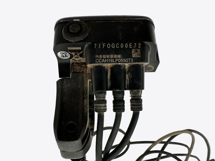 Black electronic component with multiple connectors on a white surface