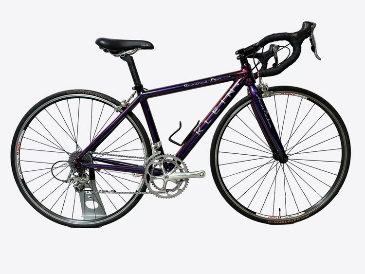 Purple bicycle on a white background