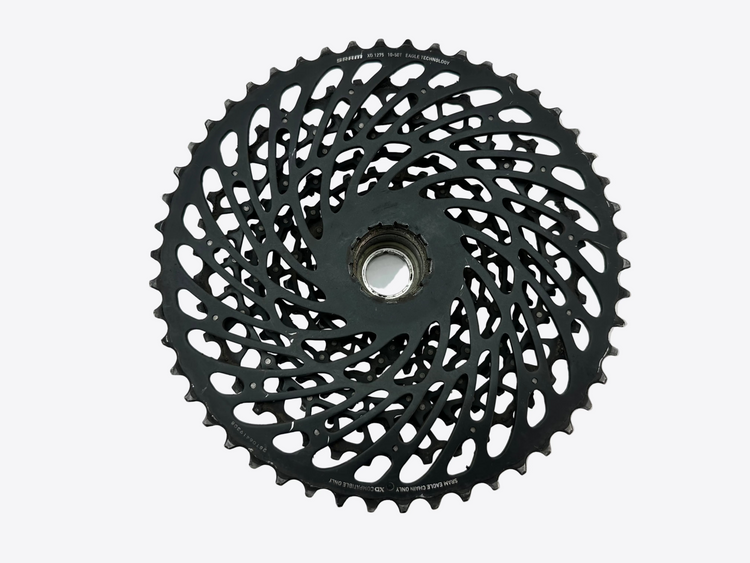 Black bicycle gear cassette on a white background