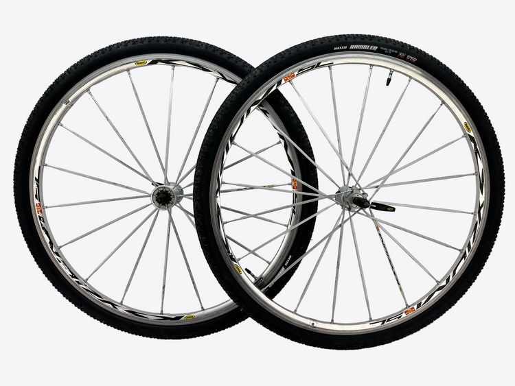 Two bicycle wheels on a white background
