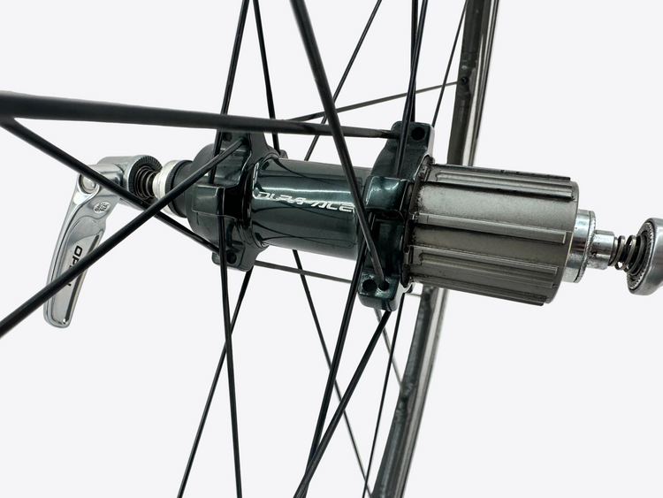 Close-up of a bicycle hub with visible brand name on a white background