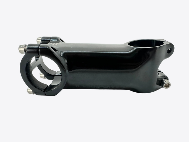 A glossy black bicycle stem with a black clamp and silver adjustment bolts, photographed on a white background.