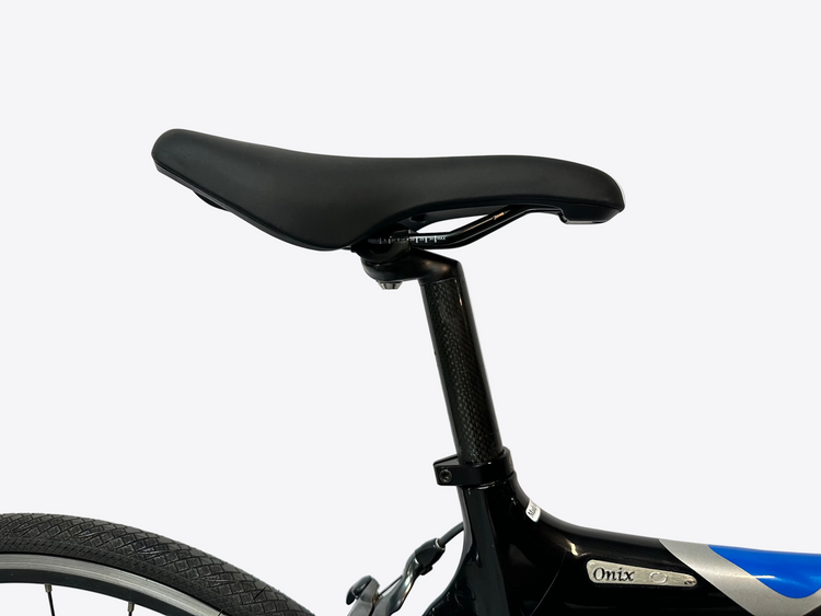 Close-up of a bicycle seat and frame against a white background
