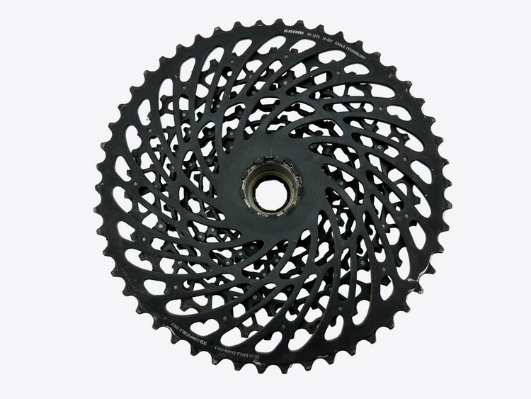 Black bicycle gear cassette on a white background