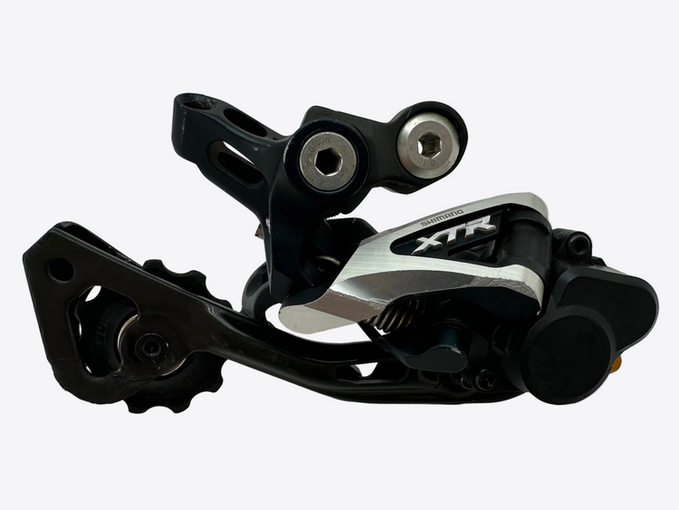 Bicycle derailleur with 'XTR' branding on a white background