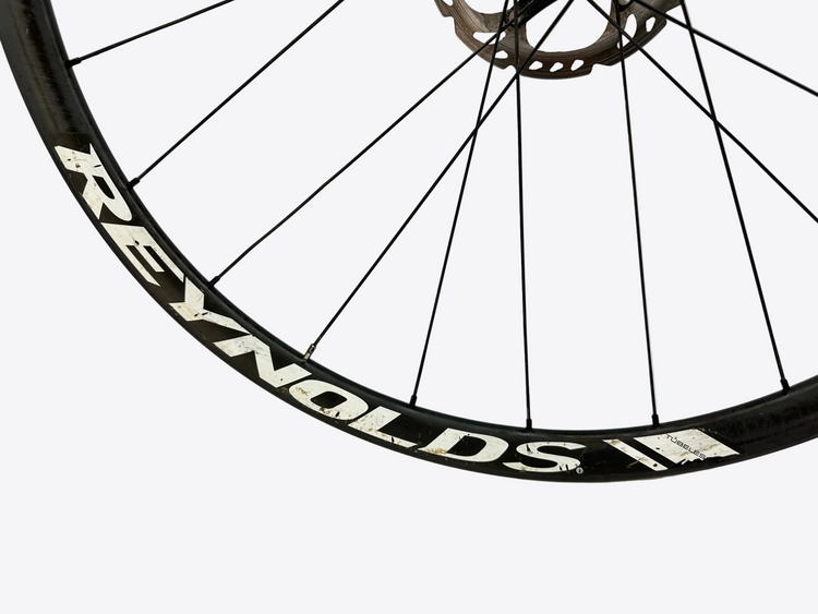 Bicycle wheel with Reynolds branding on a white background