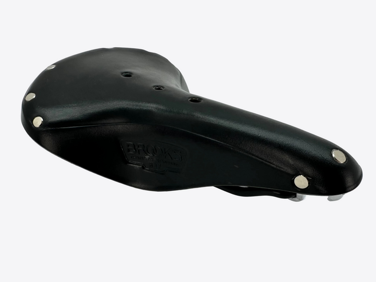 Black bicycle saddle with silver bolts on a white background