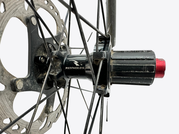 Close-up of a bicycle hub with Reynolds branding on a white background