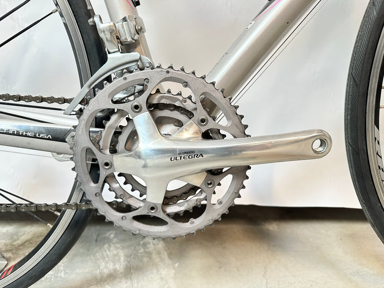 Close-up of a bicycle crankset with 'Ultegra' branding on a blurred background