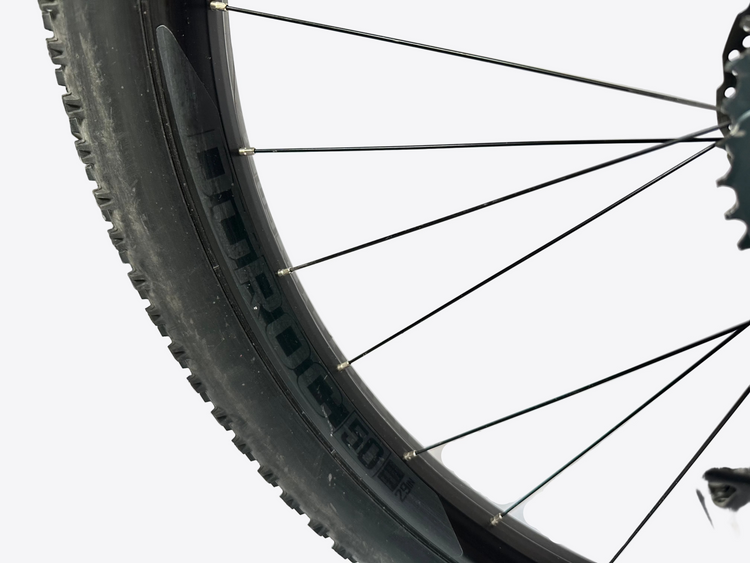Close-up of a bicycle wheel with a white background