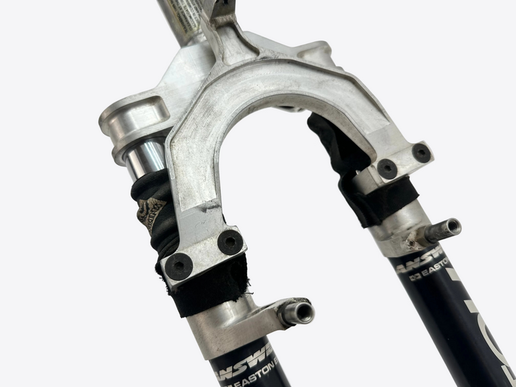 Close-up of a bicycle fork with brand name on a white background
