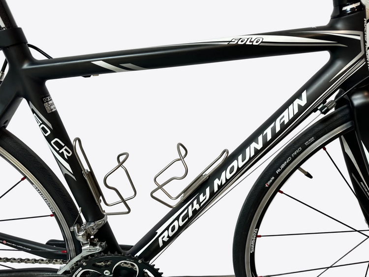 Black Rocky Mountain bicycle frame with white lettering on a light gray background