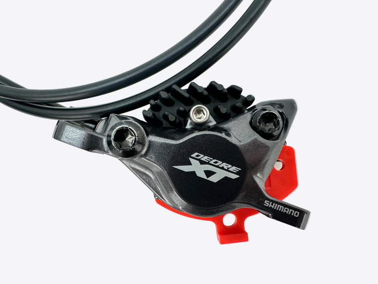 Shimano Deore XT brake lever on a white background
