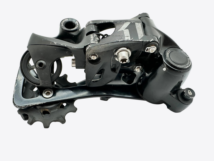 Black mechanical component with gears on a white background