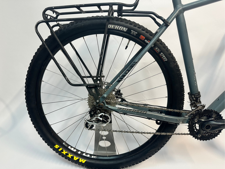 Close-up of a bicycle wheel with a white background
