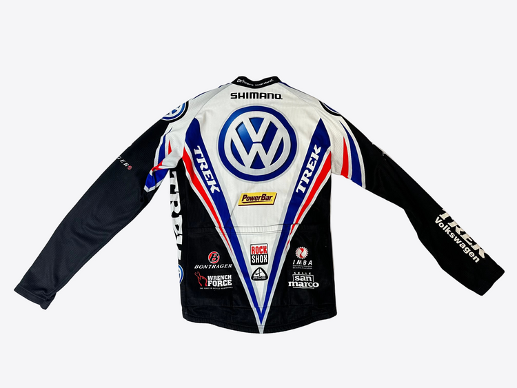 bike racing jersey with various brand logos on a light gray background