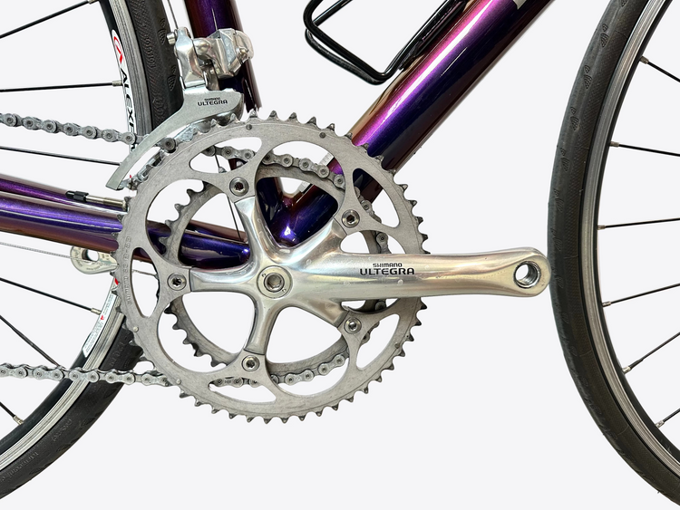 Close-up of a bicycle crankset with 'Ultegra' branding on a blurred background