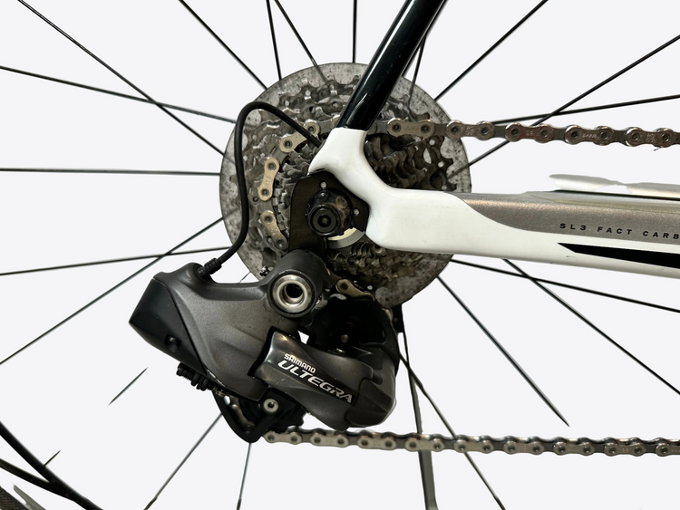 Close-up of a bicycle's gear system with a white background