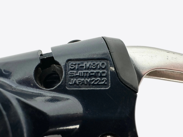 Close-up of a Shimano bicycle component with branding on a white background