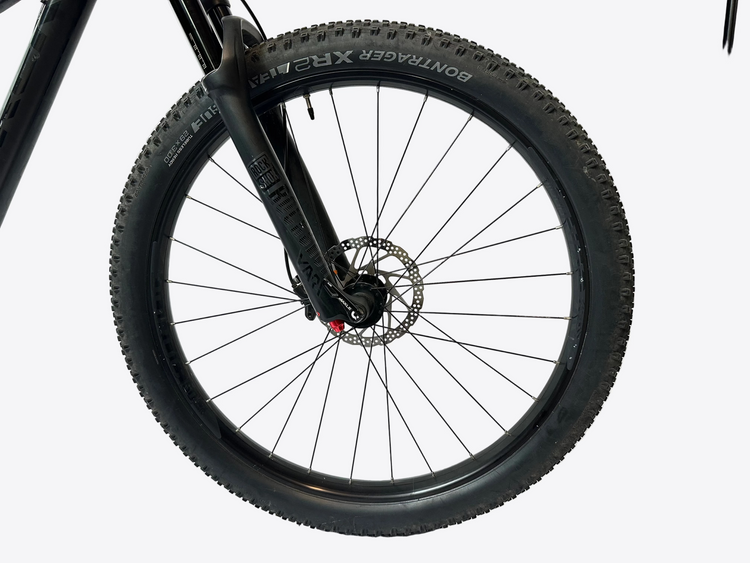 Close-up of a bicycle wheel with a white background