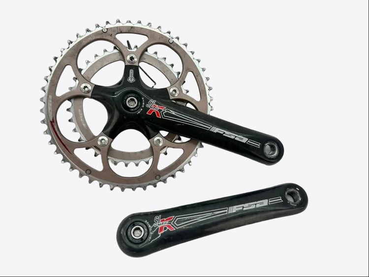 Bicycle crankset with chainring on a light gray background