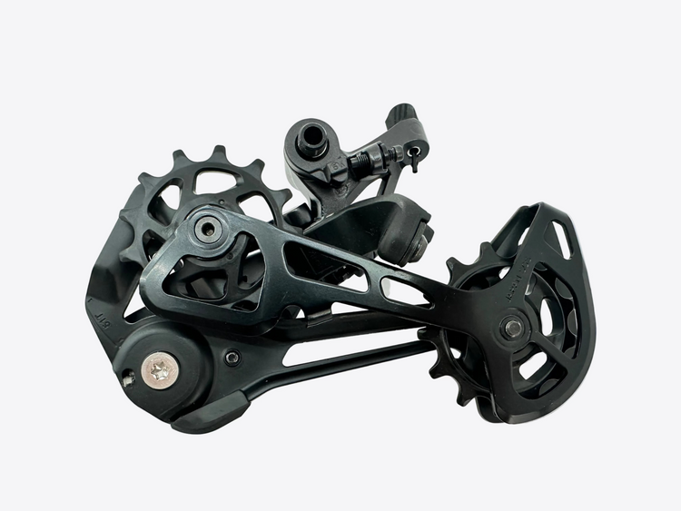 A black Shimano bicycle rear derailleur photographed on a plain white surface.