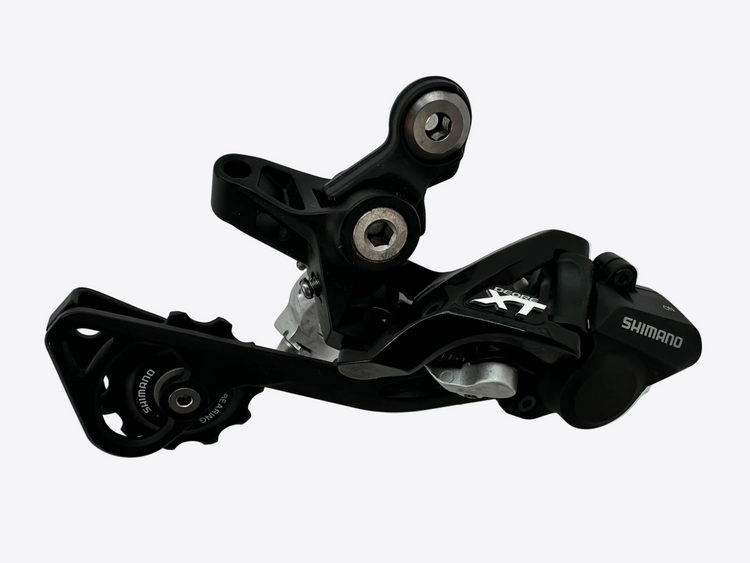 Black Shimano XT mechanical component on a white background