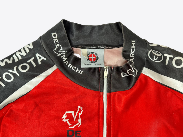 Red and black jacket with Toyota and De Marchi logos on a white background