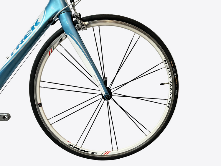 Close-up of a bicycle wheel with a white background