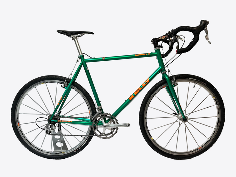 Green bicycle on a white background