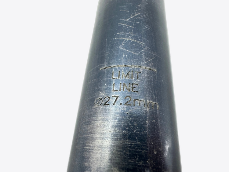 Metal tube with 'LIMIT LINE 027.2mm' marking on a light gray background