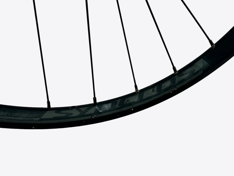 Close-up of a bicycle wheel rim on a white background