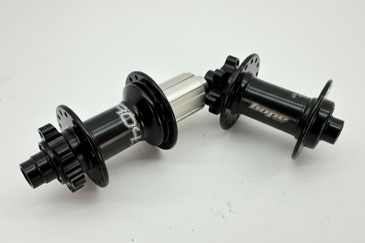 Two bicycle hubs on a white background