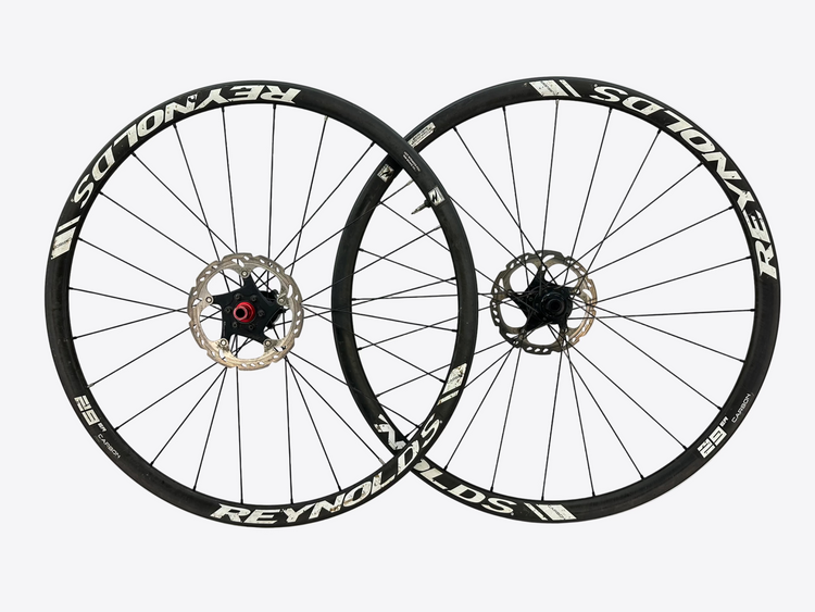 Two bicycle wheels with Reynolds branding on a white background