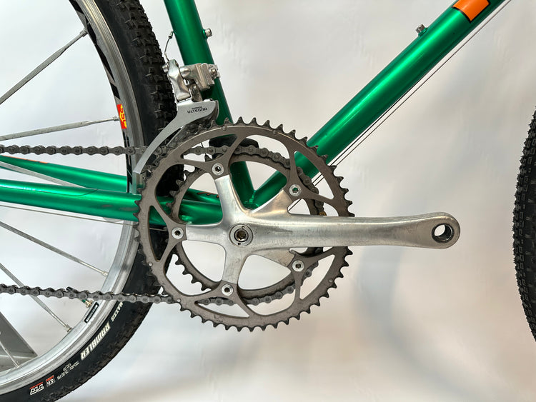Close-up of a bicycle's chain and gear system on a blurred background
