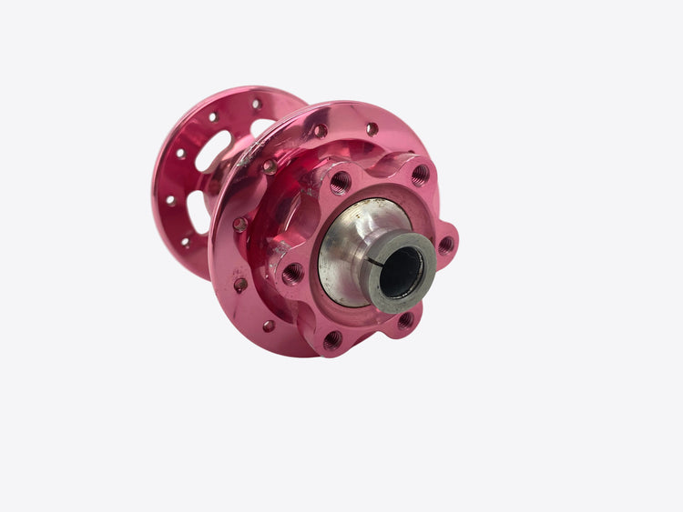 close up of the left front hub flange with small scratches on flange and brake mount