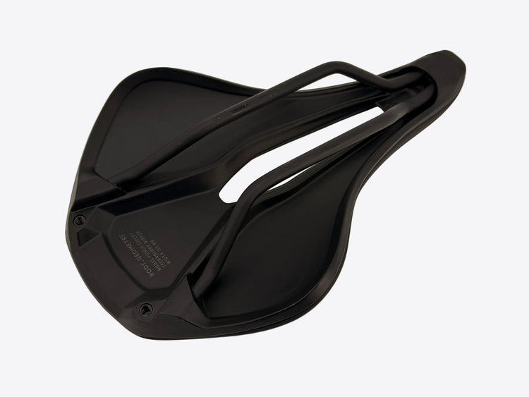 A black bicycle saddle shown from a top-down angle on a plain off-white background.