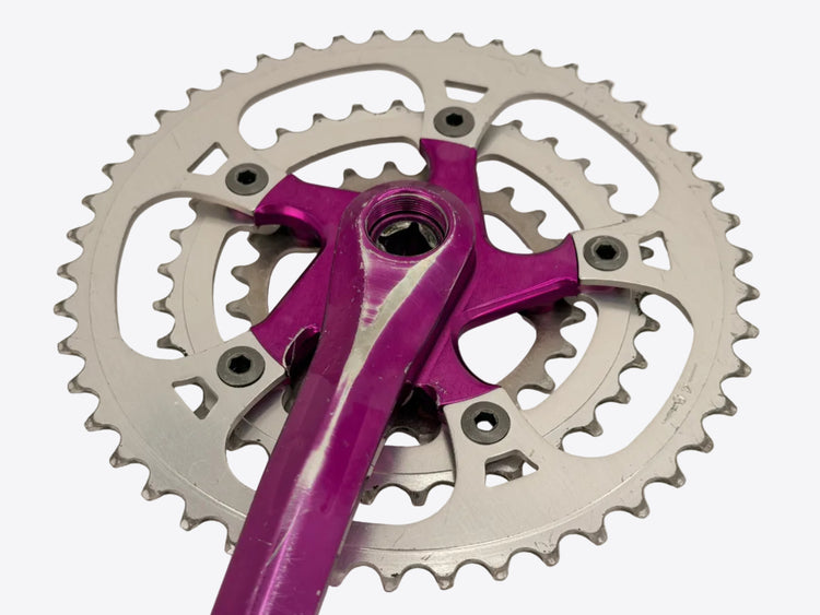 purple anodized crank chainrings close up