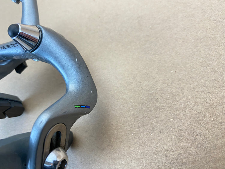 scratches on caliper arm of rear brake