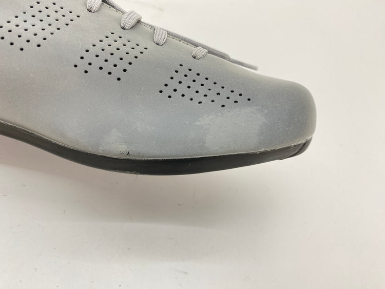 scuffs on the left shoe