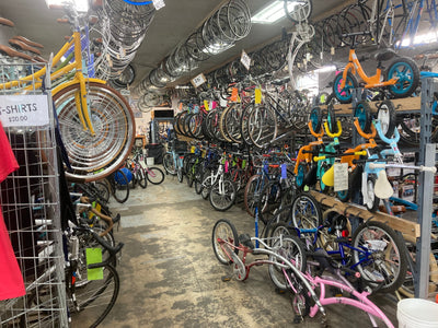 A beautiful community bicycle shop filled with bicycles that have been lovingly refurbished. An angel sings as the clouds part and light descends from the heavens. 