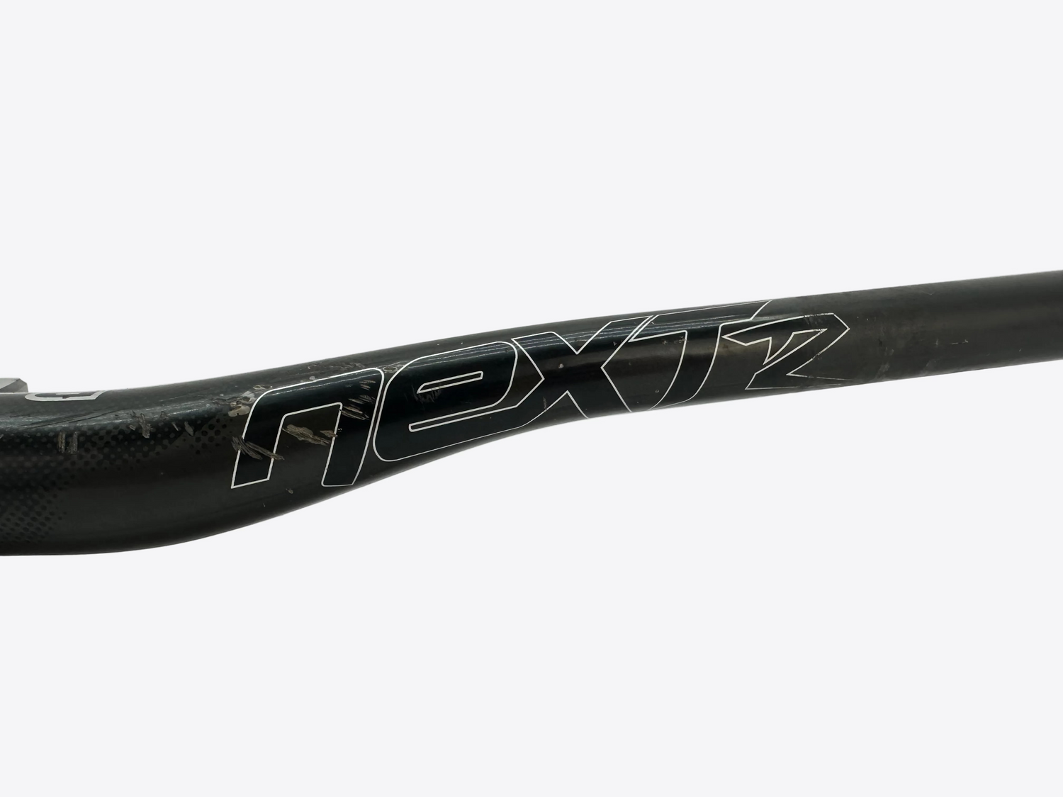 Carbon fiber handlebar with 'Next2' branding on a white background