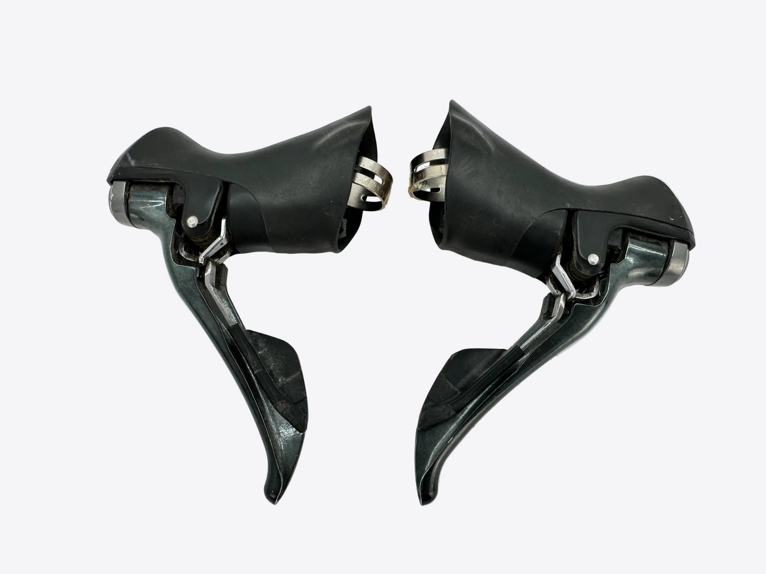 Pair of black bicycle shifters on a white background