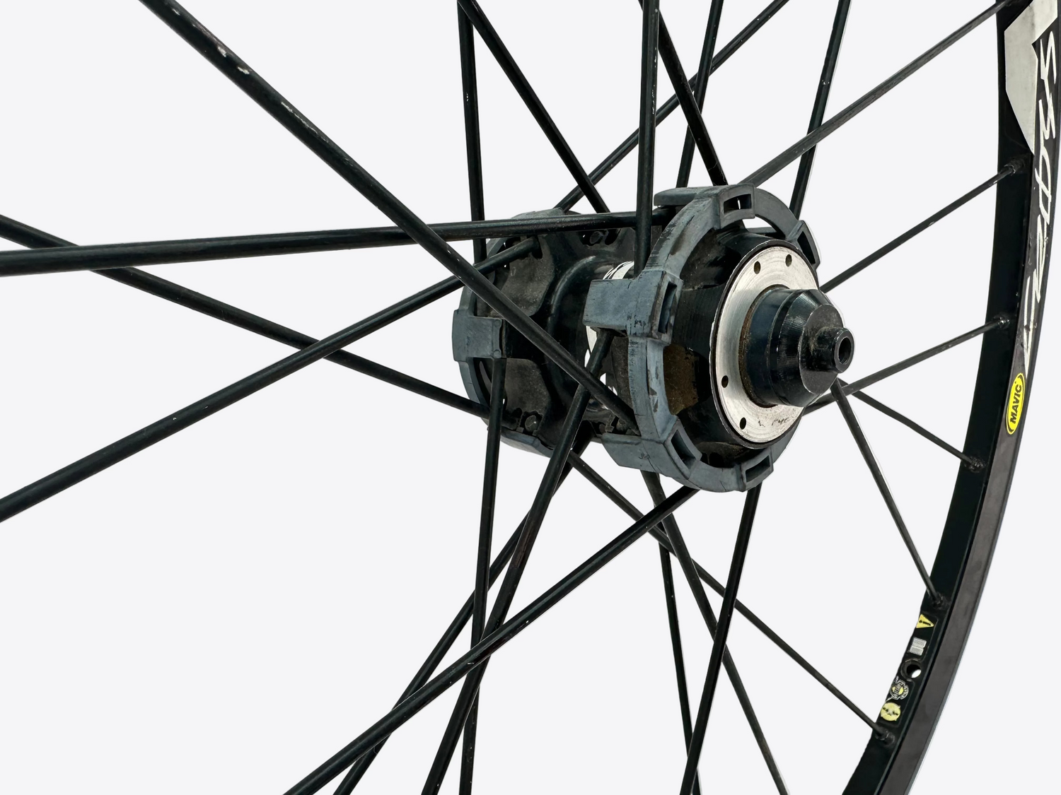 Close-up of a bicycle wheel with a white background