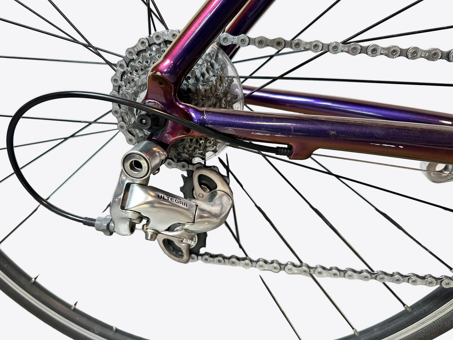 Close-up of a bicycle's gear system with a white background
