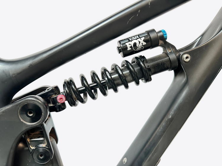 Close-up of a bicycle suspension fork with Fox logo on a blurred background