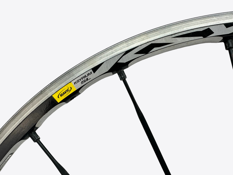 Close-up of a bicycle wheel with a white background