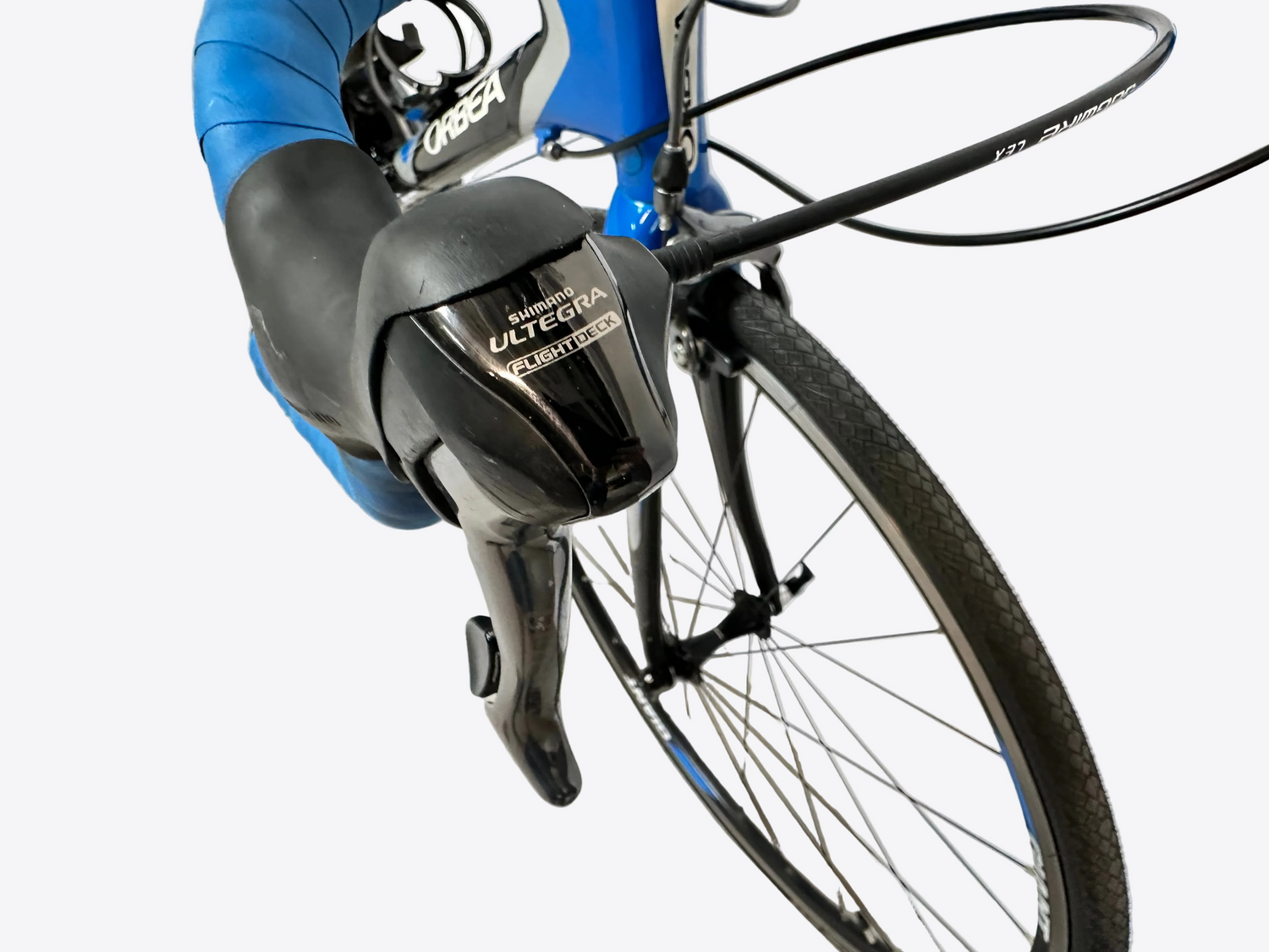 Close-up of a bicycle handlebar with Shimano Ultegra shifters on a blurred background